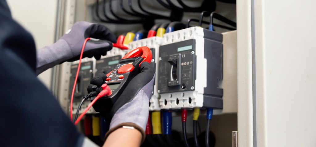 Licensed electrician in Pretoria inspecting a DB board in a residential home.